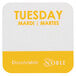 A white and yellow square sticker with the word "Tuesday" in yellow.