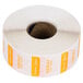 A roll of white and orange Noble Products food labeling stickers.