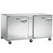 A Traulsen undercounter freezer with left hinged doors and stainless steel back on wheels.