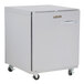 A Traulsen undercounter refrigerator with a stainless steel back and wheels.