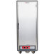 A gray Metro C5 3 Series heated holding cabinet with a solid door on wheels.