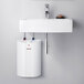 A white rectangular Stiebel Eltron mini tank water heater with red button.