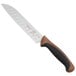 A Mercer Culinary Millennia Colors Santoku knife with a brown handle.