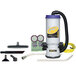 A ProTeam backpack vacuum cleaner with accessories and tools.