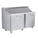 A Traulsen stainless steel sandwich prep table with two left hinged doors.
