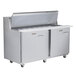 A Traulsen stainless steel refrigerated sandwich prep table with two left hinged doors and two drawers.
