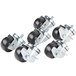 A set of Traulsen swivel casters with black rubber wheels and metal frames.