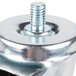 A close-up of Traulsen swivel stem casters with a metal bolt and nut.