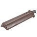 A brown plastic tube with a metal handle.