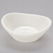 A Tuxton eggshell white china jelly dish with a curved edge.