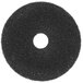 A black circular Scrubble super stripping floor pad with a hole in the center.