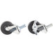 A set of Traulsen swivel casters with black rubber wheels and nuts on them.