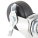 A close up of a Traulsen swivel caster wheel with a metal handle and clamp.