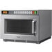 A silver Panasonic commercial microwave oven with a digital display.