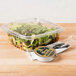 A salad in a Genpak clear hinged deli container.