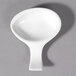 A 10 Strawberry Street Whittier white porcelain small spoon with a handle.