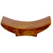 A Town wooden chopstick rest with a curved shape on a white background.