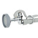 A T&S white and grey wall mounted pre-rinse faucet with hose and handle.