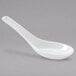 A white porcelain Chinese wonton spoon with a long handle.