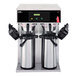 A Curtis twin airpot coffee brewer on a counter.