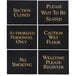 A group of four black Aarco hostess signs with gold text.
