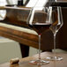 Two Stolzle Quatrophil burgundy wine glasses on a table