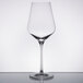 A close-up of a Stolzle Quatrophil wine glass with a clear surface.