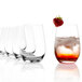 A row of empty Stolzle stemless wine glasses with a strawberry on top.