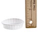 A Solo white paper portion cup next to a ruler.