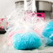 A case of blue Great Western Blue Raspberry Cotton Candy Floss Sugar cartons on a counter.