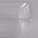A Vollrath 1/3 size clear plastic food pan on a counter.