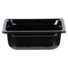 A black Vollrath Super Pan 1/4 size black plastic food pan on a counter.