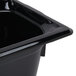 A close-up of a black Vollrath Super Pan food container.
