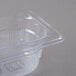 A clear polycarbonate Vollrath food pan with a lid.