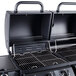 A black Backyard Pro portable grill with the lid open and a door open.
