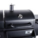 A black Backyard Pro portable outdoor grill with a lid and a gauge.