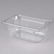 A Vollrath clear polycarbonate food pan with lid.