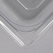 A close-up of a clear Vollrath 1/4 size clear polycarbonate food pan.
