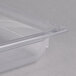 A Vollrath clear polycarbonate food pan with a lid.