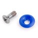 A close-up of a screw and a blue plastic round object with a hole.
