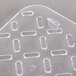 A clear polycarbonate tray with holes.
