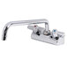 A chrome Equip by T&S wall mount faucet with lever handles and an 8 1/8" swing spout.