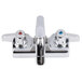 A chrome Equip by T&S wall mount faucet with 2 lever handles and a swing spout.