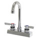 A chrome Advance Tabco deck-mounted faucet with gooseneck nozzle and lever handles.