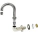 An Advance Tabco wall mount faucet with a swivel gooseneck spout and brass pipe.
