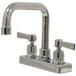 An Advance Tabco deck-mounted faucet with two lever handles and a 6" extended nozzle.