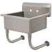 A stainless steel Advance Tabco wall mount service sink with metal bars on the side.