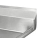 A close-up of a stainless steel Advance Tabco commercial sink with right drainboard.