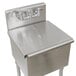 A stainless steel Advance Tabco sink compartment cover over a stainless steel sink.