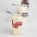A clear Fineline dome lid on three clear Tiny Tumblers filled with strawberries and cream.
